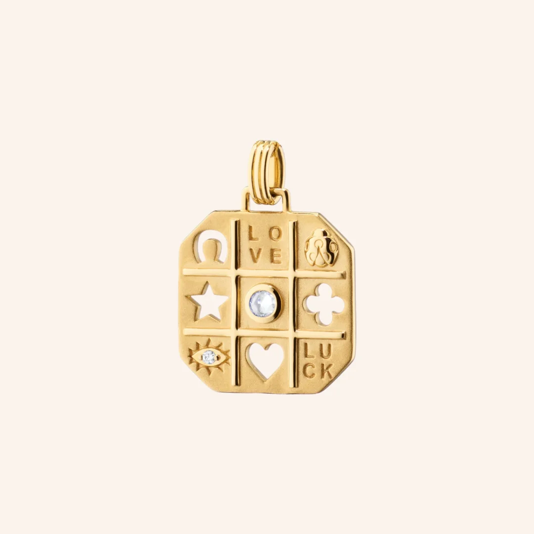 18k yellow gold with one rose cut diamond that totals 0.02 carats.